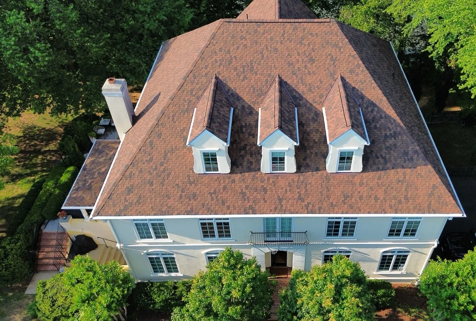 Aerial view of a completed architectural asphalt shingle roof on a home
